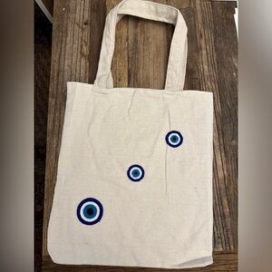 Brand new evil eye canvas tote bags.